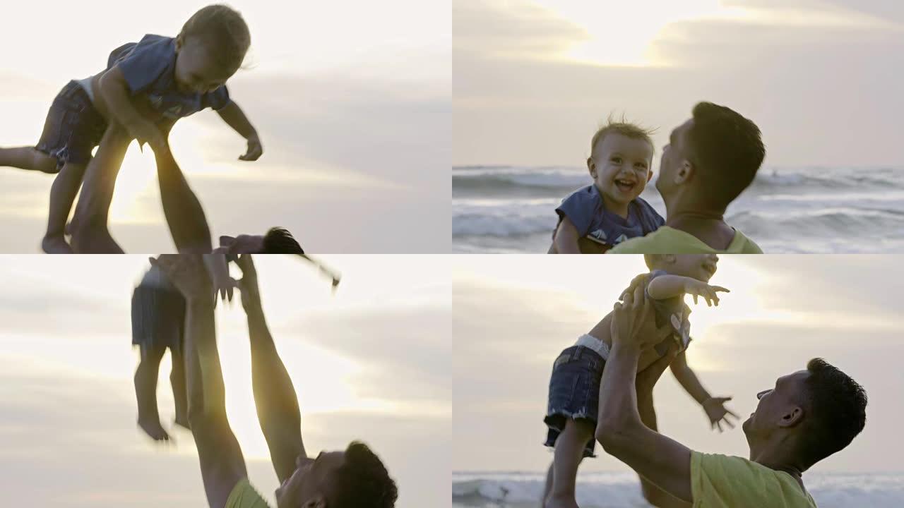 父亲和小儿子在海滩上笑