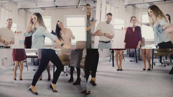 快乐的女孩在办公室派对上跳月球漫步舞。多民族员工一起跳舞，庆祝业务成功4K