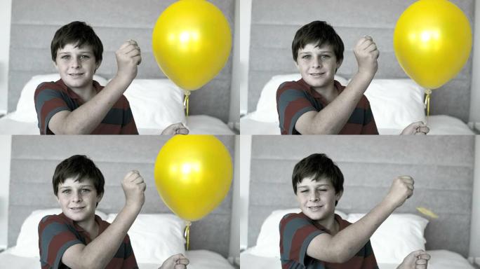 男孩刺穿他的气球