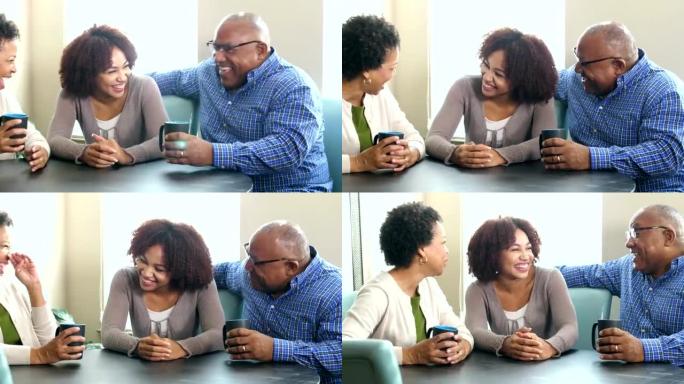 年轻的非裔美国妇女与父母交谈