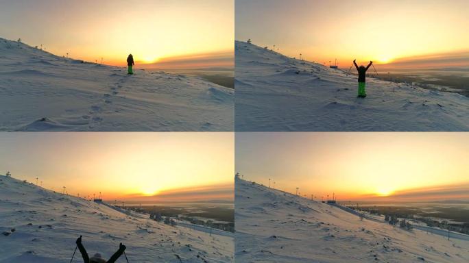 空中活跃的女人雪鞋在雪山斜坡上抬起手臂