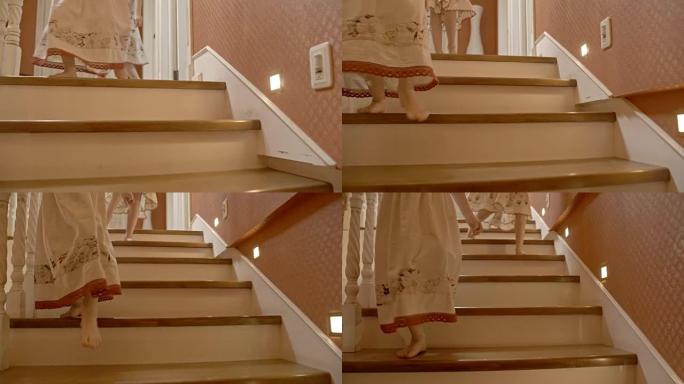 低矮的女孩走下楼梯