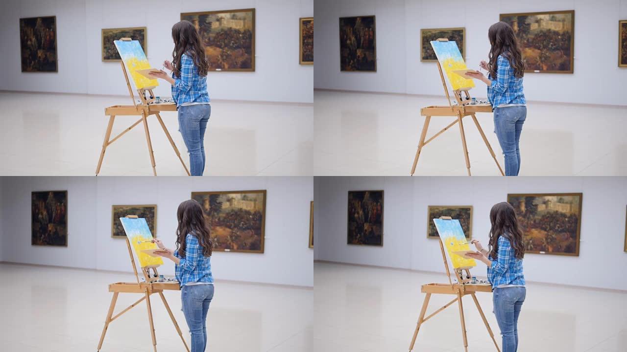 女性时尚画家在画架上画画。4K。