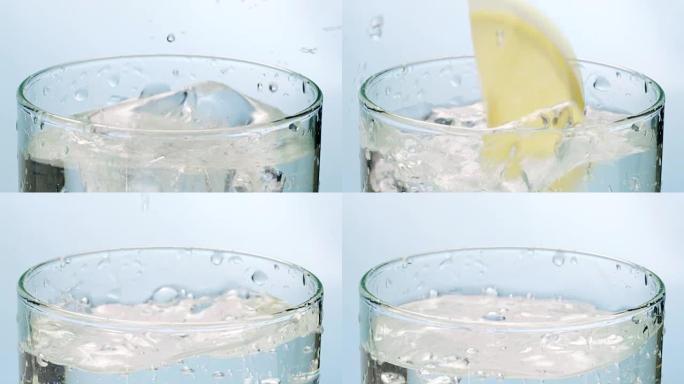 冰块和柠檬片掉在水杯中