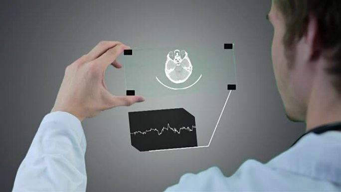 无法识别的科学家，医生使用未来派触摸屏技术，显示x射线。运动图形