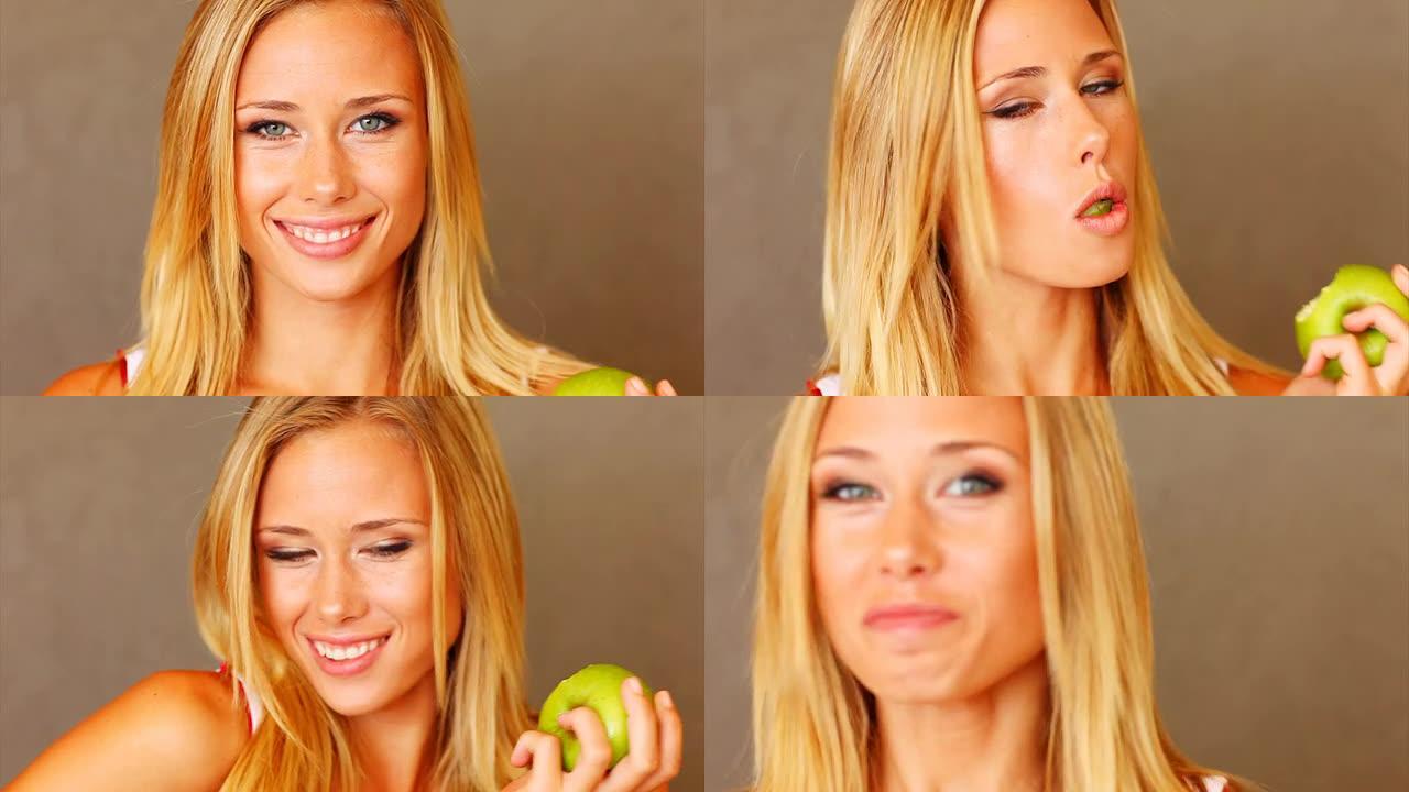 美女吃苹果的特写金发美女绿色有机减肥餐