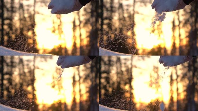 慢动作: 双手sc起新鲜的柔软雪花，并在日落时将其掉落