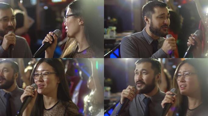 亚洲女性与男性朋友一起唱歌