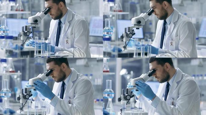 研究科学家在培养皿中调整标本，并在显微镜下观察。他在一个现代化的实验室里工作。