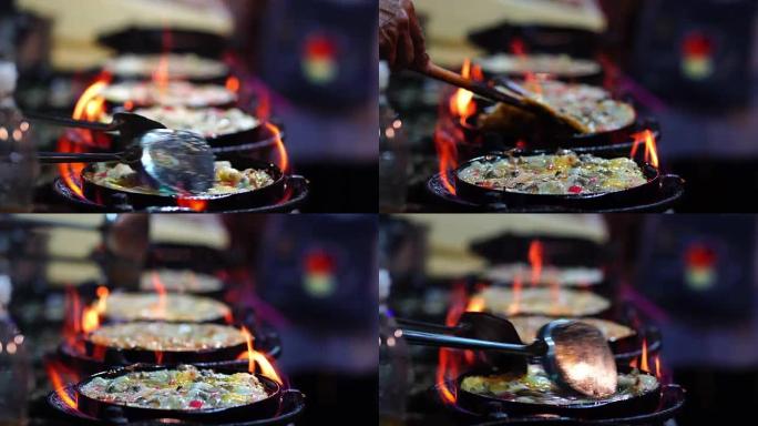 4k特写镜头烹饪煎虾用平底锅的铁锹炒