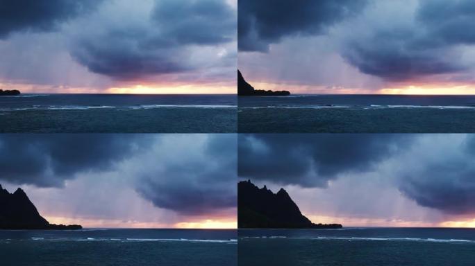 鸟瞰图飞越大洋礁，并在考艾岛北岸掀起戏剧性的日落风暴