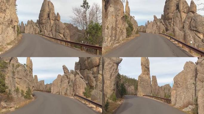 POV: 在Needles高速公路上行驶，经过陡峭的深渊上方雄伟的岩石尖顶