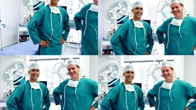 男性外科医生在手术室中双手叉腰站立的肖像