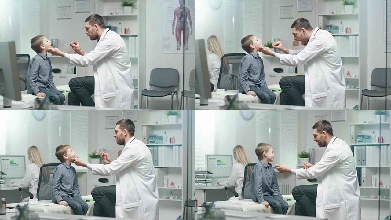 男医生检查年轻男孩的喉咙。护士在后台很忙。