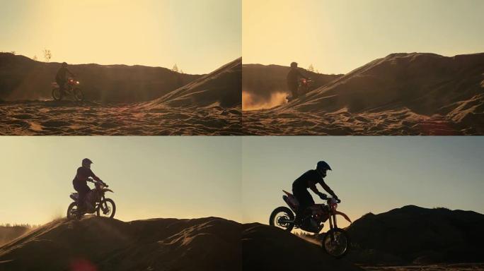 专业摩托车越野赛摩托车骑手驾驶越过沙丘和更远的越野轨道。这是日落。