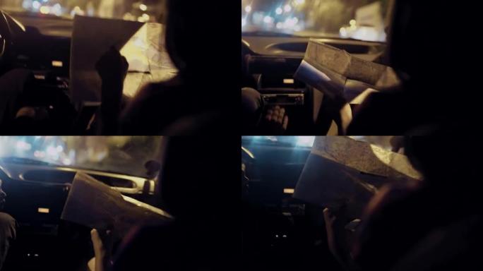 驾驶汽车中的女人阅读地图