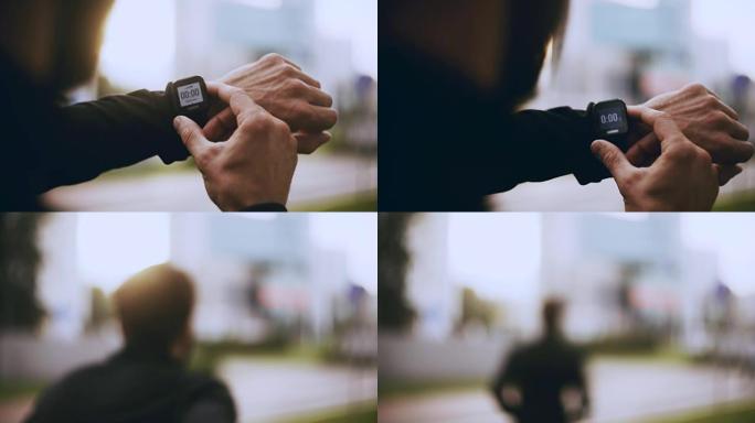 4K Runner启动智能手表计时器并运行。男子在慢跑前检查心率监测器。生活方式视点拍摄