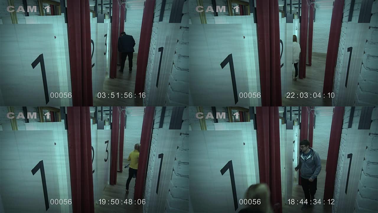 闭路电视安全摄像头延时拍摄百货公司试衣间里的人的镜头。