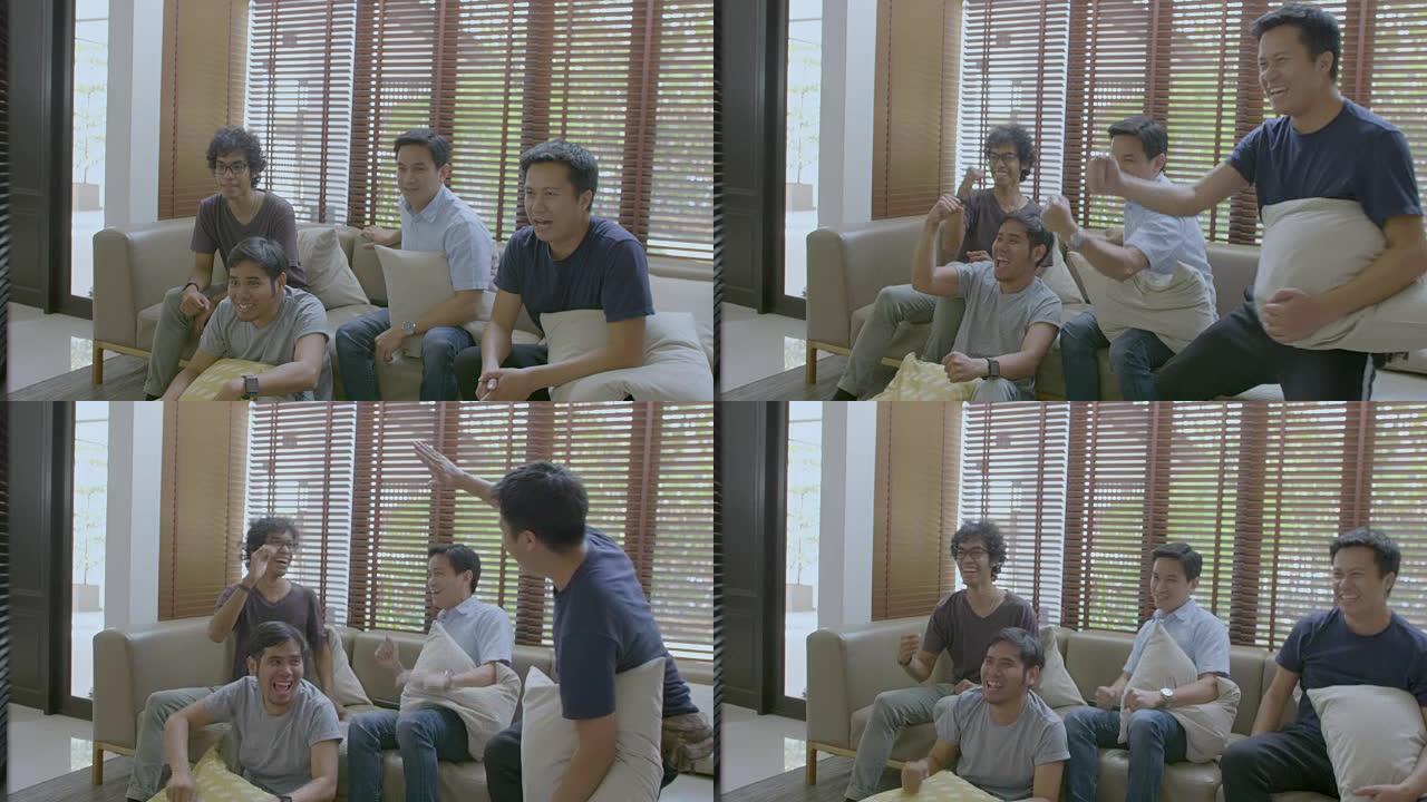 一群亚洲扁友在家电视观看体育比赛