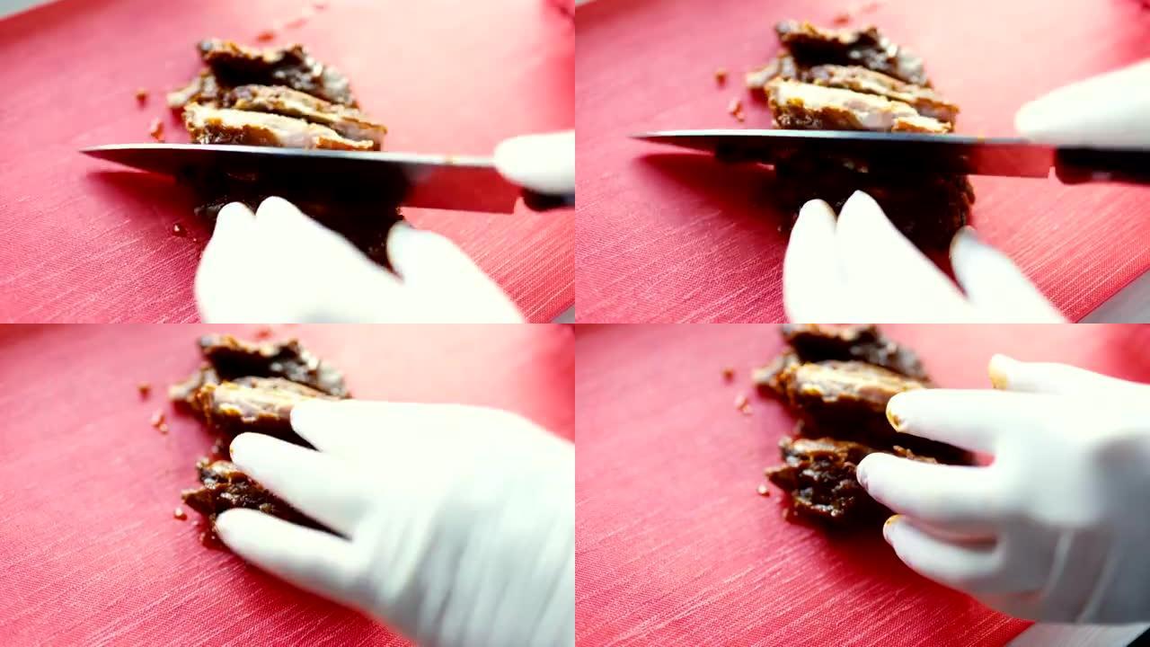 厨师在厨房板上切猪肉的特写镜头