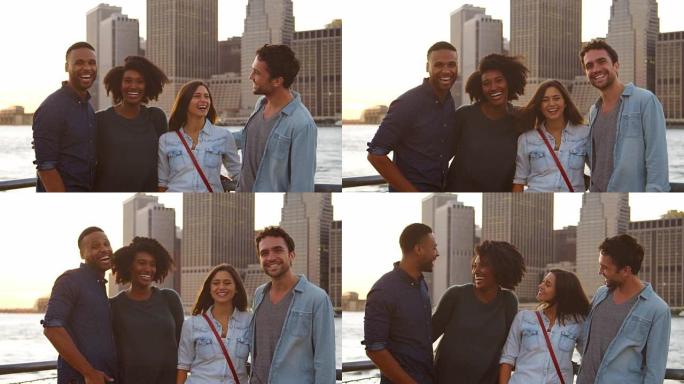 两对友好的年轻夫妇在曼哈顿的河边大笑