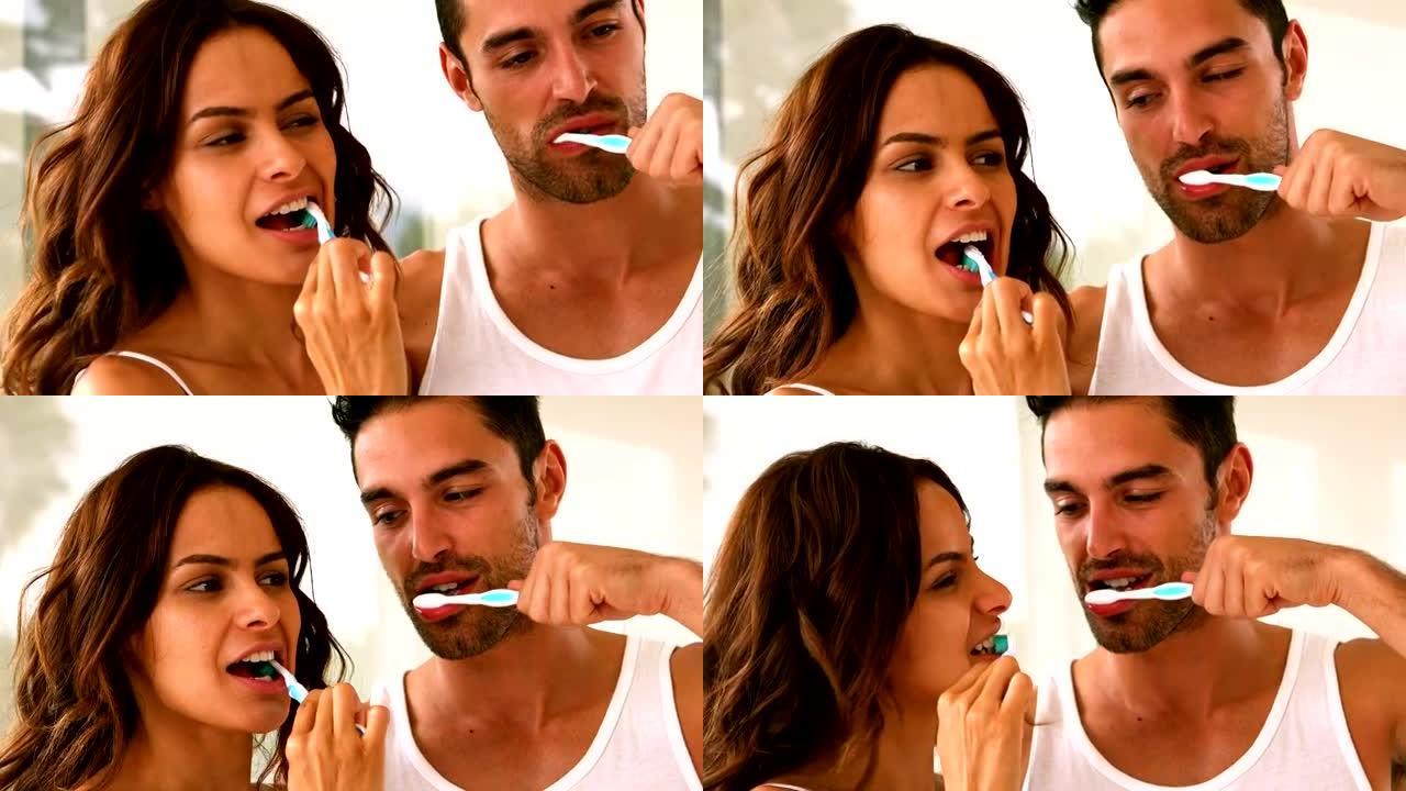 夫妇用牙刷洗牙