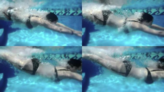 女人慢动作潜水。240fps