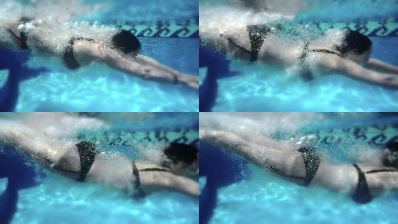 女人慢动作潜水。240fps