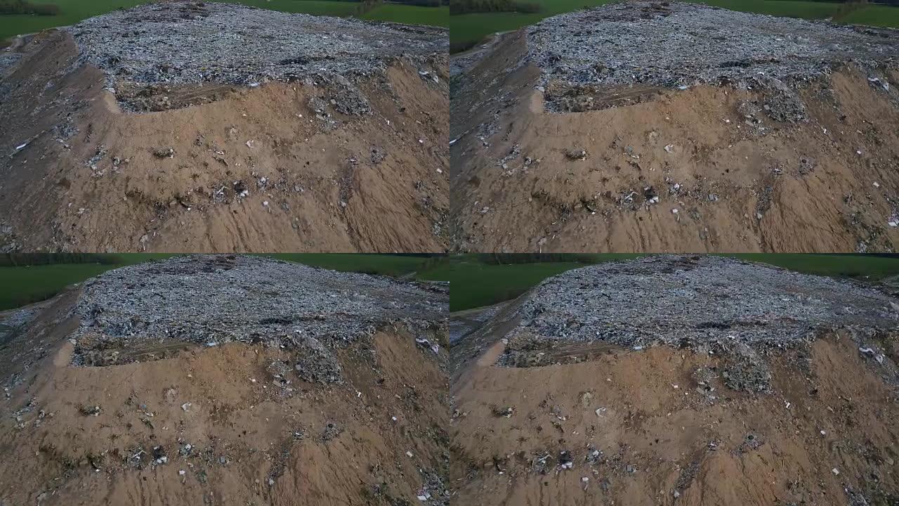 空中无人机拍摄的生态破坏。无人机在城市垃圾场周围飞行。大堆垃圾