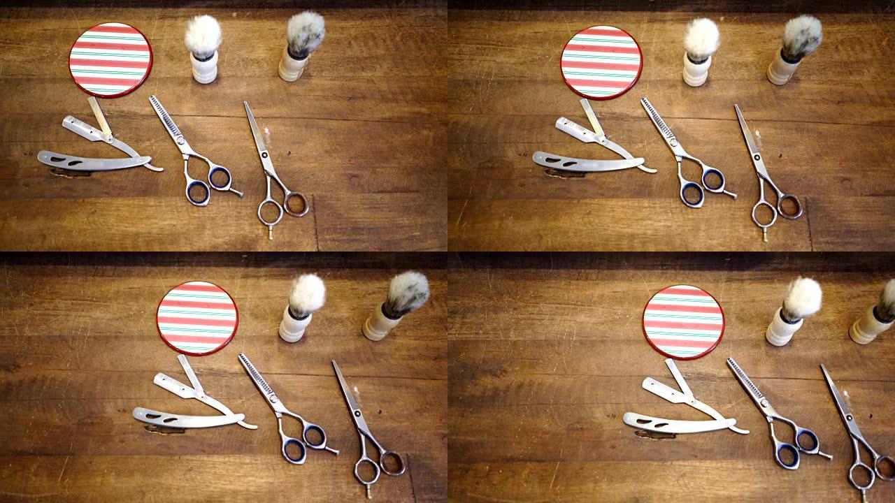 木桌上的理发师工具的平移视图