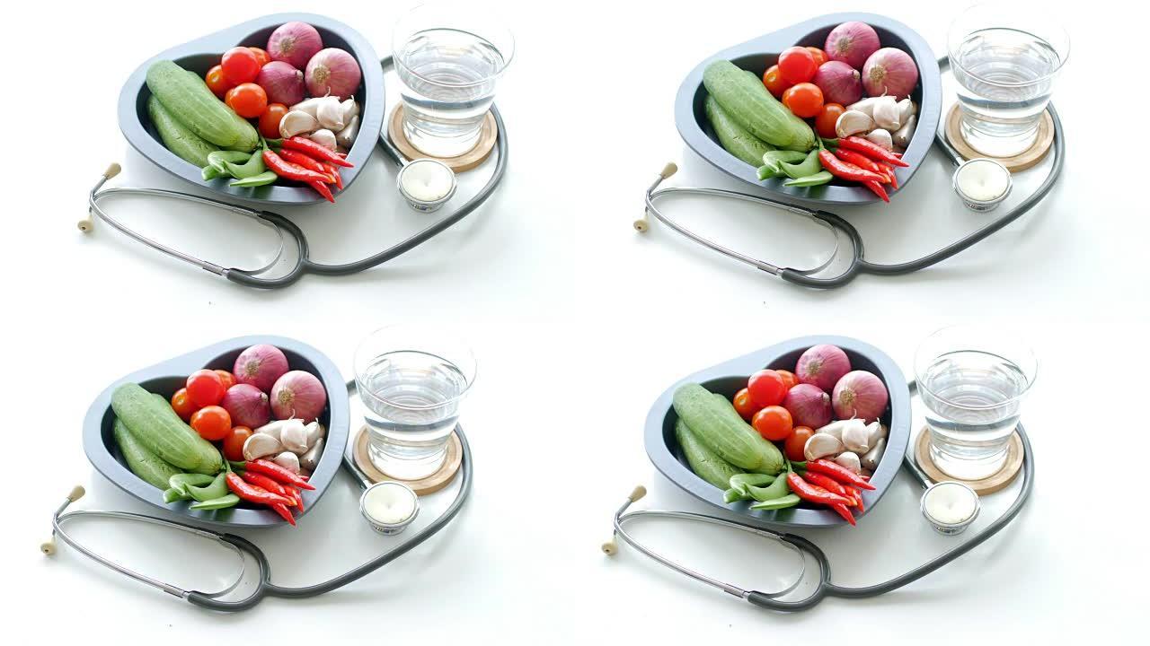 健康食品蔬菜和医疗听诊器白色背景健康概念