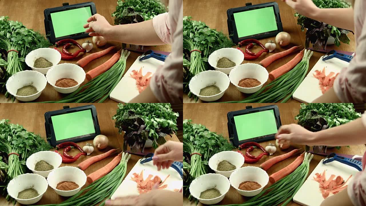 女人用平板电脑烹饪食物