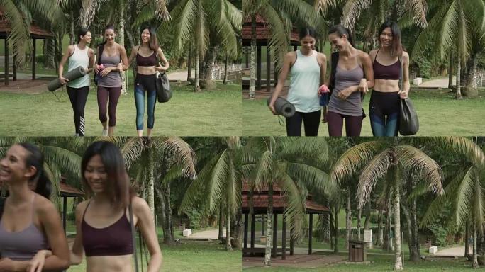 三个多民族朋友步行去公园参加瑜伽课