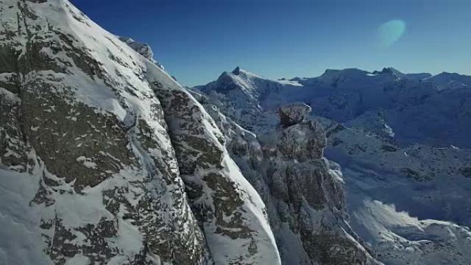 Aerial view of snow covered mountain range with be