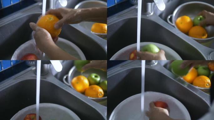 高级女性洗手清洗新鲜水果