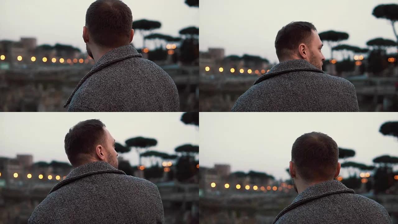 考虑到意大利罗马市中心的景点，英俊的游客站在镜头前。慢动作