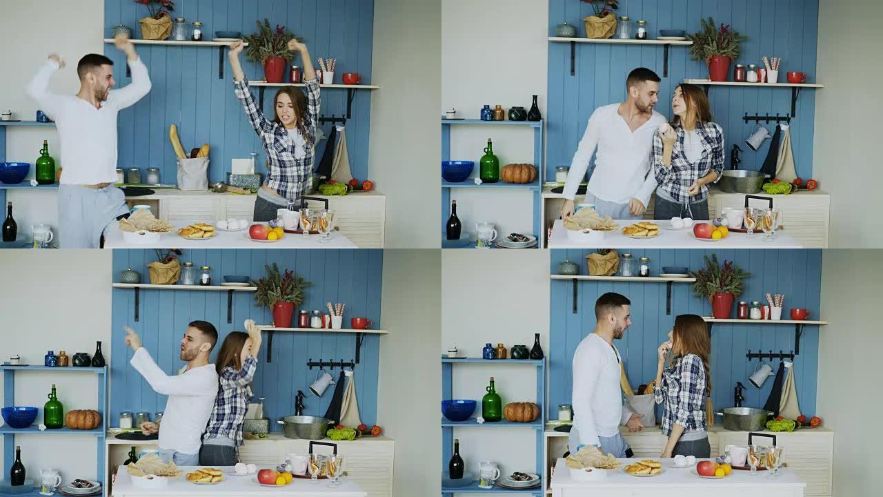 年轻的快乐夫妇在家里的厨房里摆桌子吃早餐时，跳舞和唱歌很开心