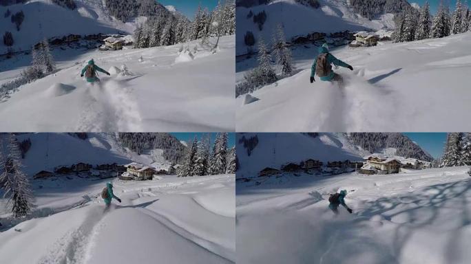 女滑雪者骑着新鲜的粉末雪走向田园诗般的奥地利小镇度假胜地