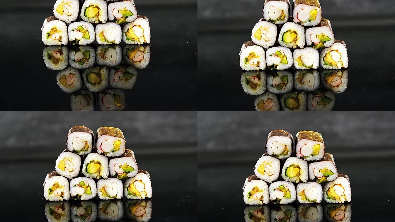 黑色背景上的maki寿司堆叠