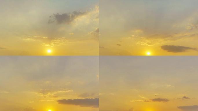 日夜延时: 金色生动的天堂日落天空延时太阳光束和光线。