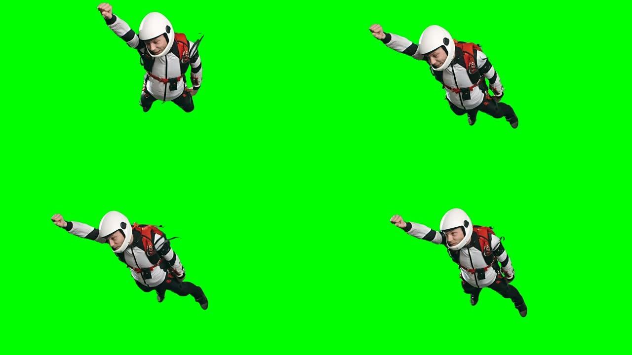 年轻的跳伞者男子以超级英雄的姿势飞行