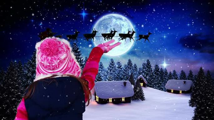小女孩向圣诞老人挥手飞过村庄