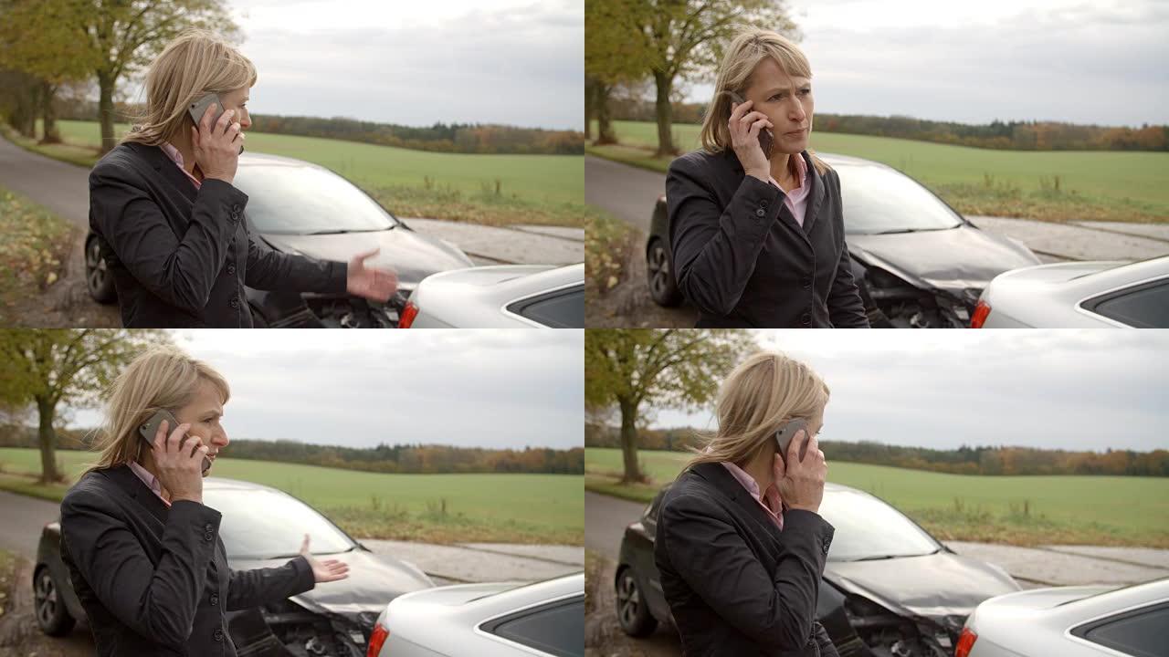 妇女打电话报告乡村道路上的车祸