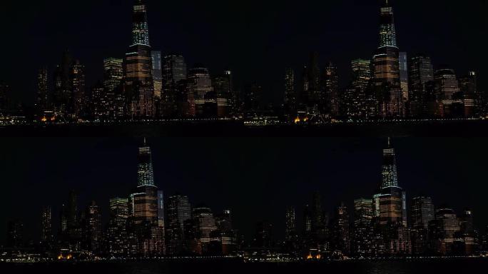 特写: 纽约市的曼哈顿天际线在神奇的夜晚被五颜六色的灯光照亮