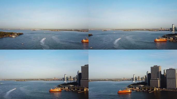 美国纽约的鸟瞰图。无人驾驶飞机飞越东河，码头，总督岛和自由女神像