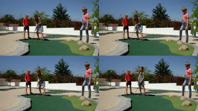 孩子们在花园里玩迷你高尔夫4k