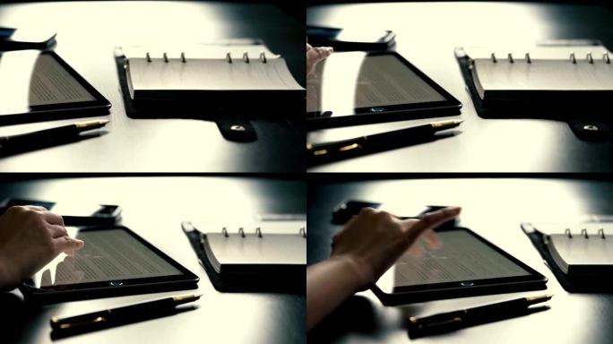 带平板笔记本和商务笔的办公桌镜头