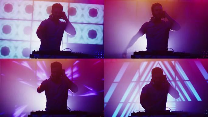 背光DJ在夜总会播放音乐。DJ的剪影。背景上明亮的动画。
