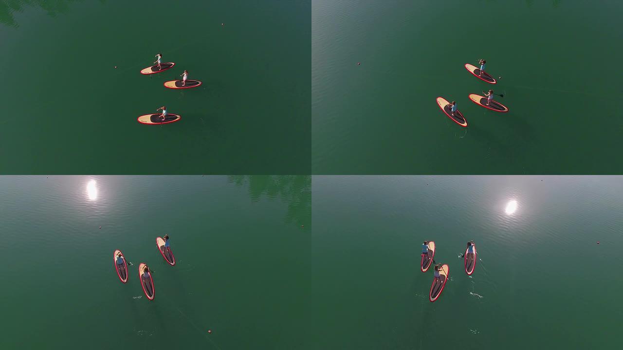空中: 三个女朋友在水面上登船