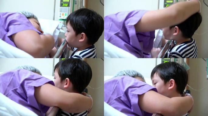 病人躺在床上检查脉搏或触摸她的儿子，小心概念。儿子亲吻她的母亲，因为病人躺在坏人身上。